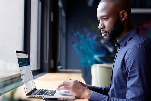 Laptop user browsing SAC campus